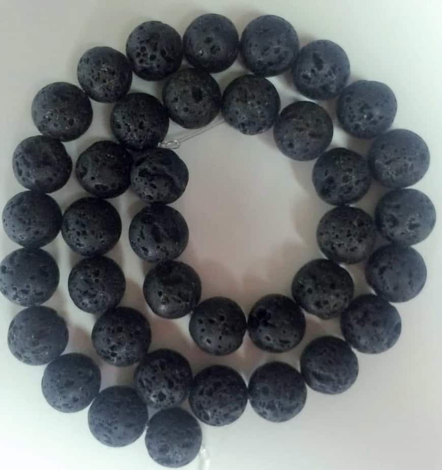 a string of black lava beads used to release the scent of essential oils in diffuser jewelry