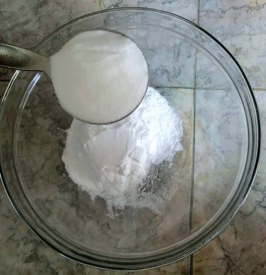 adding citric acid to mixing bowl