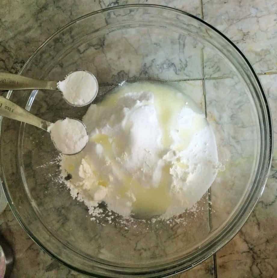 adding cream of tarter to mixing bowl