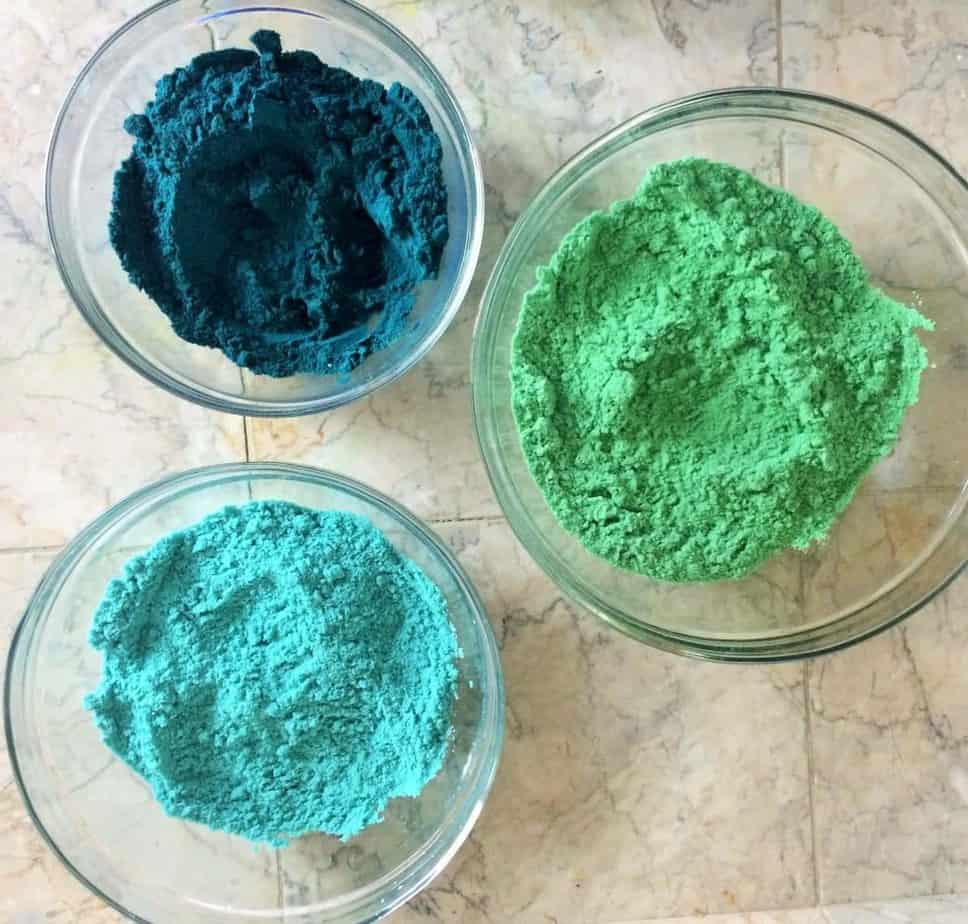 three versions of sea breeze bath bombs colorings- green, turquoise, and blue