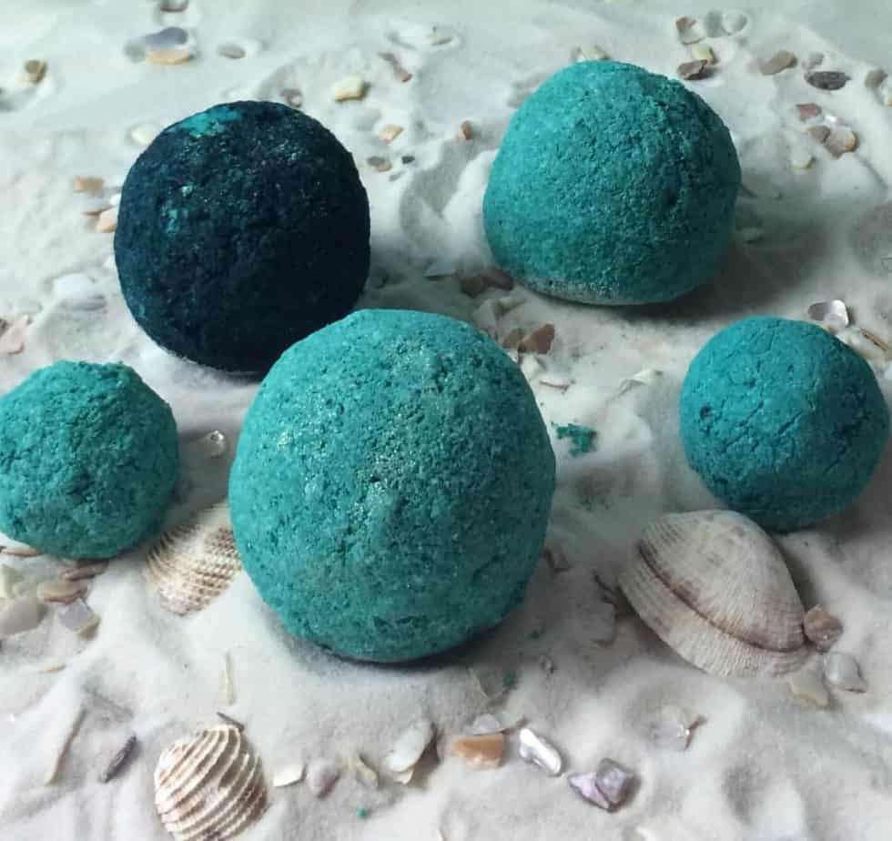 5 sea breeze bath bombs on sand with sea shells
