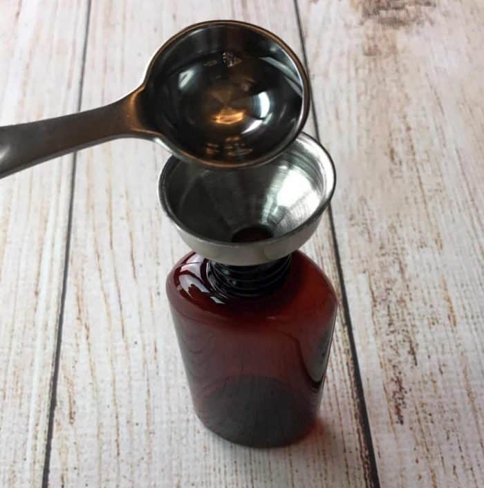 adding ingredient to hand sanitizer