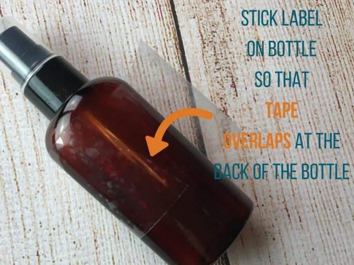 stick label on bottle so that tape overlaps at the back of the bottle