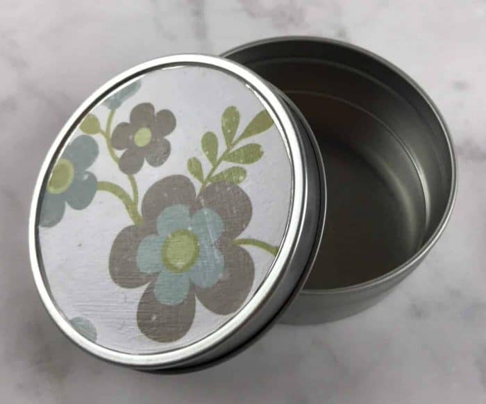 decorate a tin container using scrapbook paper and Modge Podge