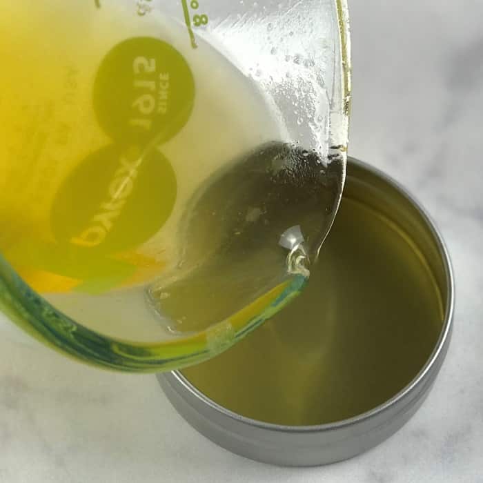 pouring anti-itch mixture into jar