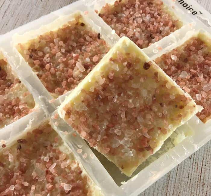 once salt scrub bars are completely cooled, remove them from silicone molds