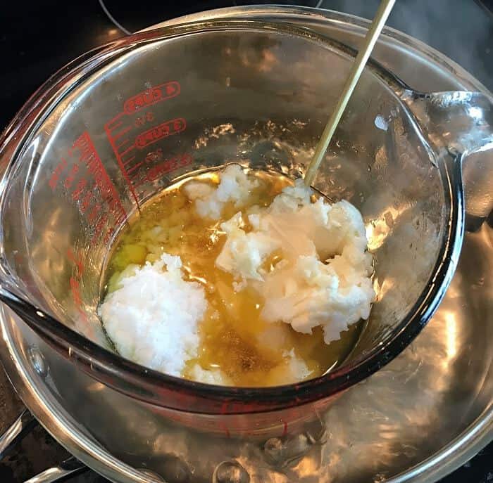 butters and oil being melted down in double boiler