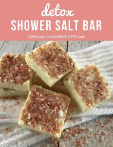 detox shower salt bar-- with pile of salt scrub bars on top of wash cloth