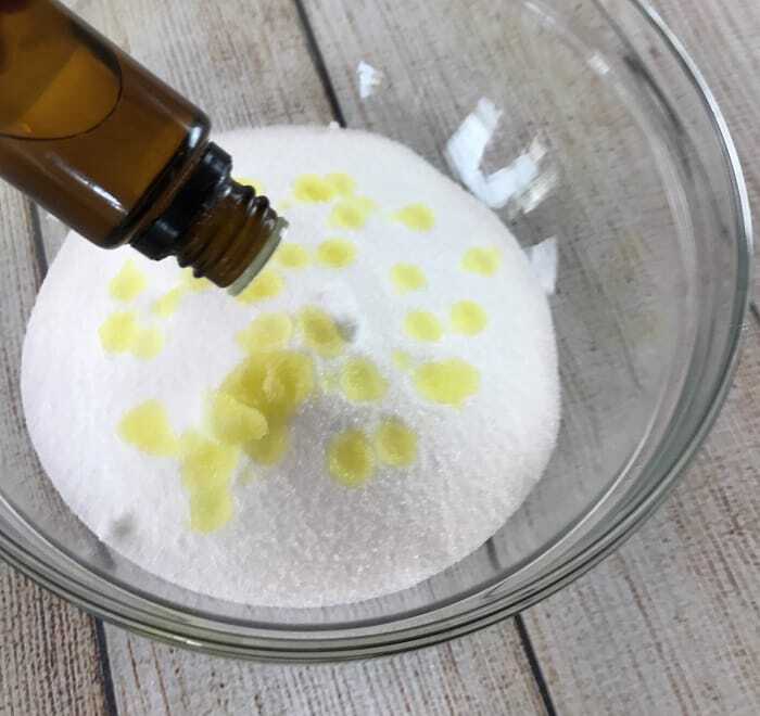 Easy-to-make natural dishwasher detergent recipe-- for clean, sparkling dishes without using harsh, toxic chemicals. {made with essential oils} DIY essential oil recipe for dishwasher detergent. #essentialoils #essentialoilrecipes #essentialoilcleaning #naturalDIY #naturalcleaning #homemadedishwasherdetergent #DIYcleaning #essentialoilDIY #essentialoilsforkitchen #easyDIY