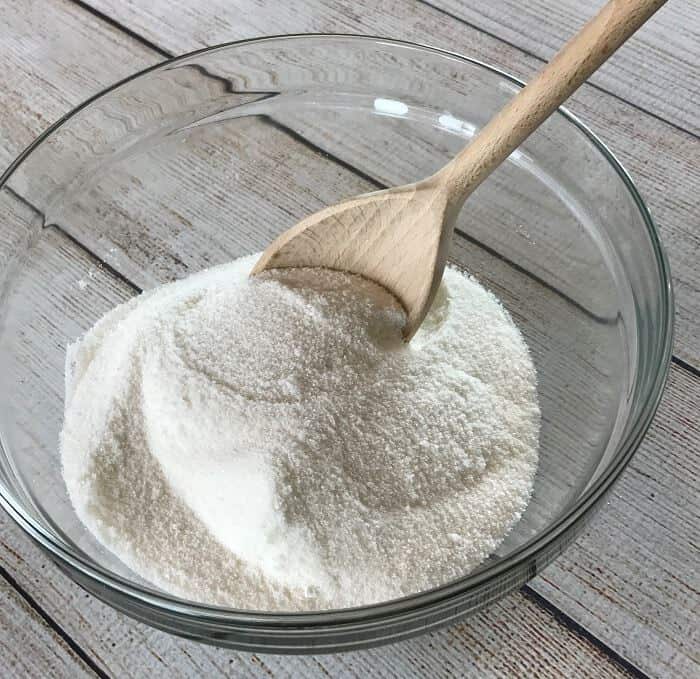 Easy-to-make natural dishwasher detergent recipe-- for clean, sparkling dishes without using harsh, toxic chemicals. {made with essential oils} DIY essential oil recipe for dishwasher detergent. #essentialoils #essentialoilrecipes #essentialoilcleaning #naturalDIY #naturalcleaning #homemadedishwasherdetergent #DIYcleaning #essentialoilDIY #essentialoilsforkitchen #easyDIY