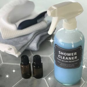 Magic homemade shower cleaner shines, cleans, and disinfects tubs, tile, and glass shower doors with practically no scrubbing to get rid of soap scum, hard water stains, dirt, grease, grime, mold & mildew. Just 3 ingredients (Dawn, vinegar, and essential oils) makes shower clean, shiny, and sparkly! {essential oil cleaner, essential oil shower cleaner, essential oil shpwer spray} #essentialoilrecipes #DIYcleaning #essentialoilcleaning #DIYessentialoil