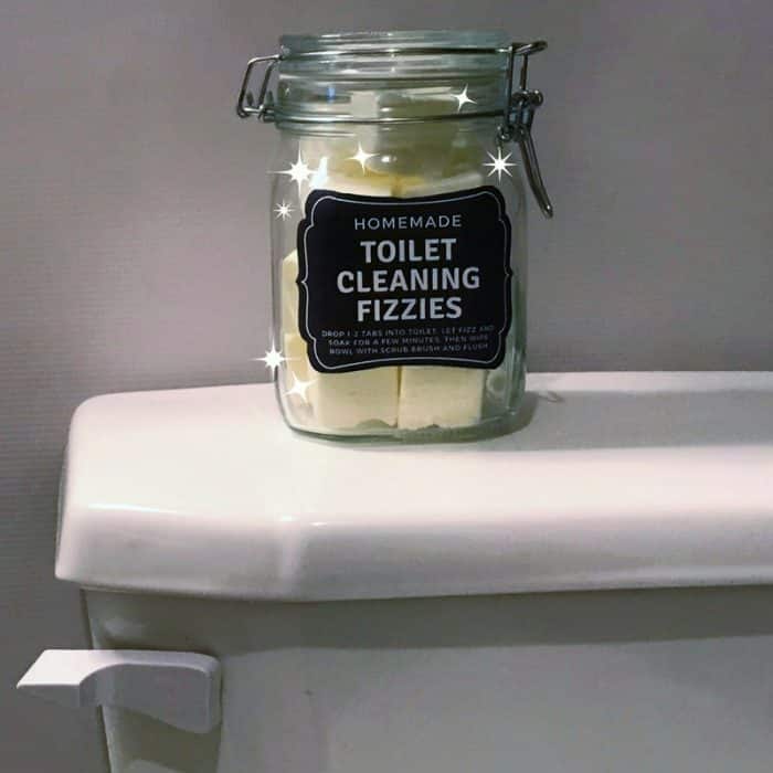 DIY Toilet Cleaning Fizzies with essential oil {aka toilet bombs) - cleans, freshens, scrubs, removes stains, deodorizes, and disinfects. made with lemon essential oil DIY natural toilet cleaner #toiletbomb #naturalDIY #toiletcleaner #bathroomcleaner #DIYessentialoil #essentialoilcleaning #lemonessentialoil
