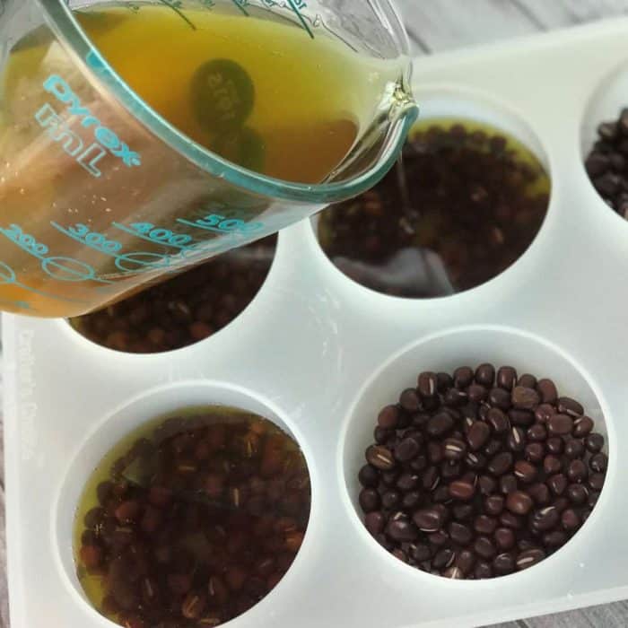 Lush copycat recipe for Wiccy Magic Muscles massage lotion bars - combination of cinnamon and peppermint essential oils provides warm, tingly sensation that soothes sore, achy muscles. Adzuki beans apply light pressure and feel like tiny little fingertips giving you a wonderful relaxing massage. #Lushcopycat #essentialoilrecipes #essentialoilDIY #essentialoiluses #lotionbars #essentialoils #DIYbeauty