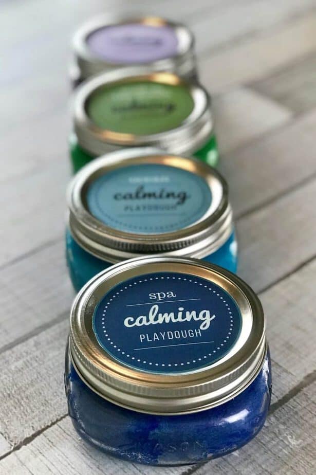 This is the absolute best homemade aromatherapy playdough to help ease stress and anxiety. Easy to customize and make your perfect scent with info about 20+ calming essential oils and 15+ soothing aromatherapy recipes. Super easy to make, uses common ingredients you probably have in your kitchen, in vibrant colors that won't stain your skin, and stays soft & pliable for months. essential oil recipe, DIY playdough, calming playdough, DIY essential oil, doTERRA, Young Living