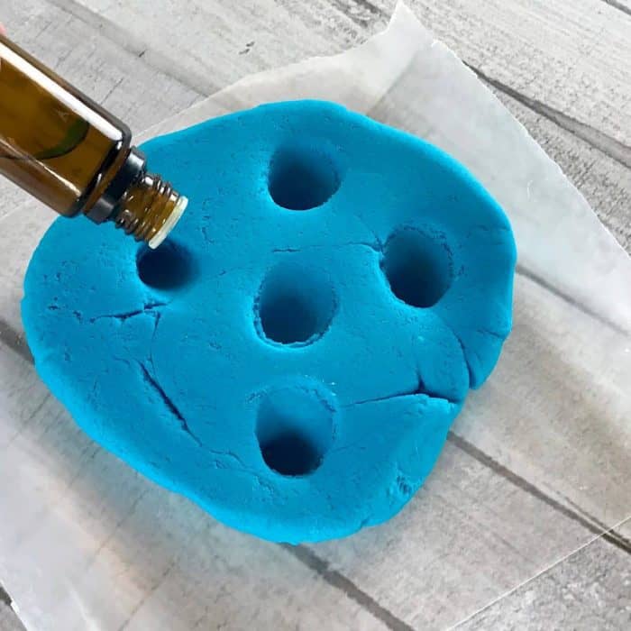 This is the absolute best homemade aromatherapy playdough to help ease stress and anxiety. Easy to customize and make your perfect scent with info about 20+ calming essential oils and 15+ soothing aromatherapy recipes. Super easy to make, uses common ingredients you probably have in your kitchen, in vibrant colors that won't stain your skin, and stays soft & pliable for months. essential oil recipe, DIY playdough, calming playdough, DIY essential oil, doTERRA, Young Living