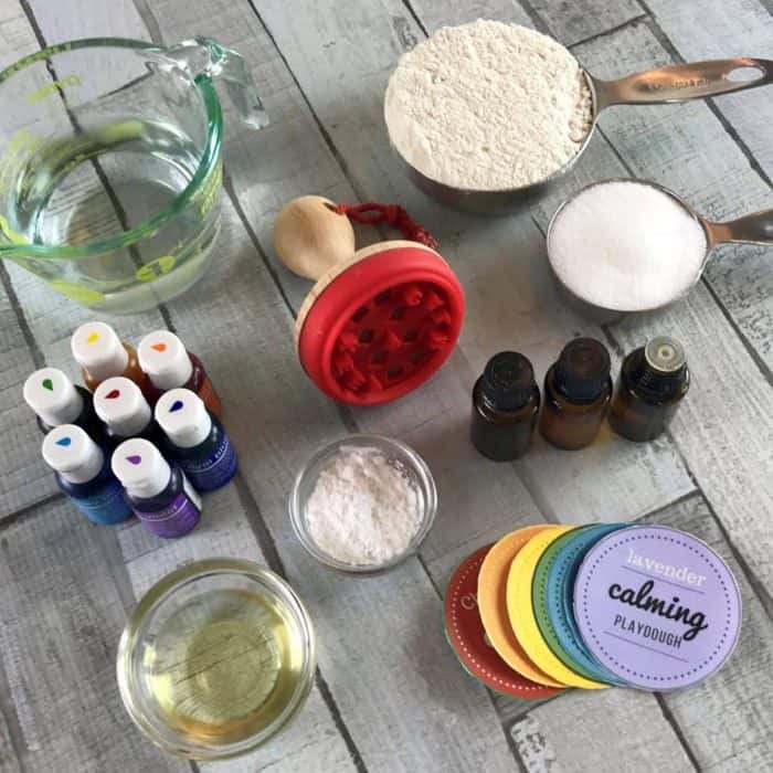 This is the absolute best homemade aromatherapy playdough to help ease stress and anxiety. Easy to customize and make your perfect scent with info about 20+ calming essential oils and 15+ soothing aromatherapy recipes. Super easy to make, uses common ingredients you probably have in your kitchen, in vibrant colors that won't stain your skin, and stays soft & pliable for months. essential oil recipe, DIY playdough, calming playdough, DIY essential oil, doTERRA, Young Living