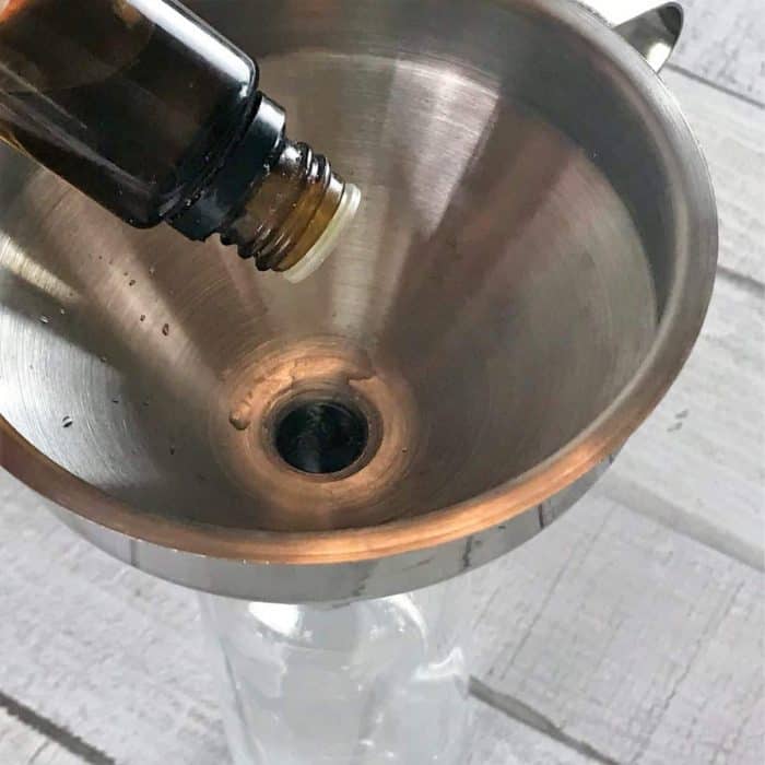 DIY trash can deodorizer spray made with essential oils- gets rid of stinky smells and keeps garbage cans smelling fresh & clean for days. {essential oil recipe, essential oil cleaning, essential oil spray, doterra, young living, plant therapy, natural cleaning} #doterra #youngliving #essentialoilrecipes