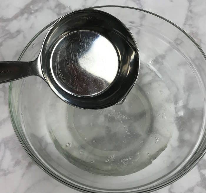 adding water to mixing bowl