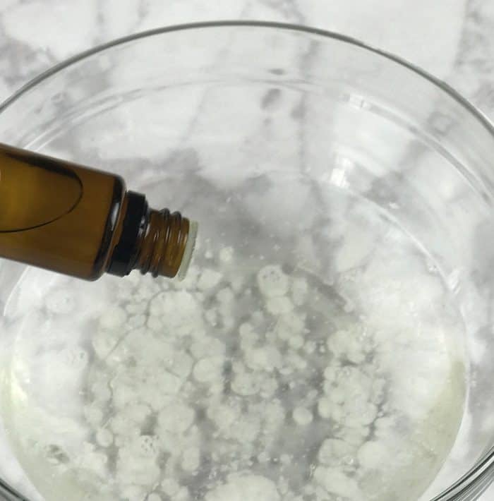 adding essential oil to homemade dish soap