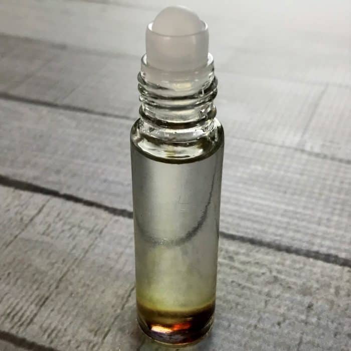 essential oil roller bottle with rollerball put on