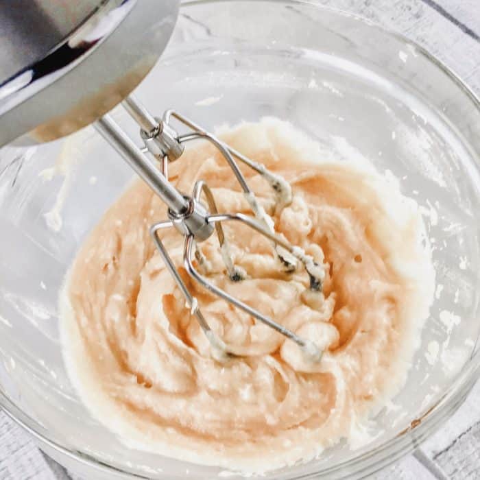 hand mixer mixing ingredients together