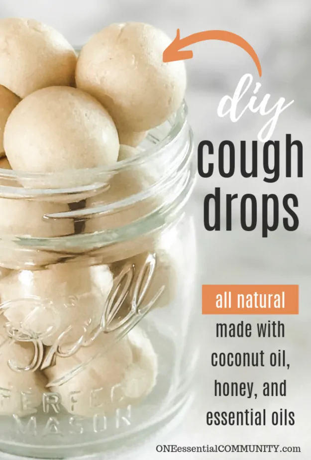 homemade coconut and honey cough drops in a glass jar with words "DIY cough drops"