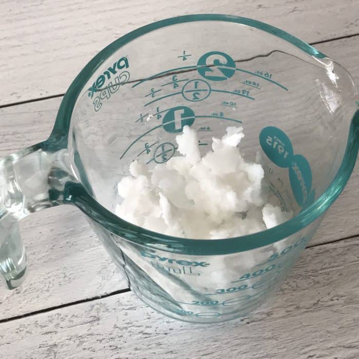 coconut oil in measuring cup