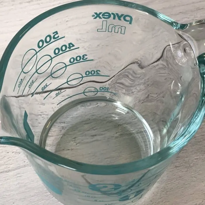 measuring cup with melted coconut oil