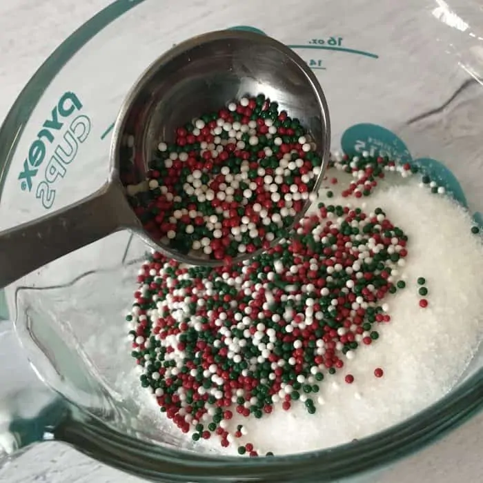 adding red and green nopareil sprinkles to mixture
