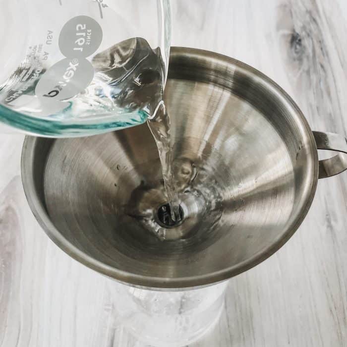 pouring in white vinegar