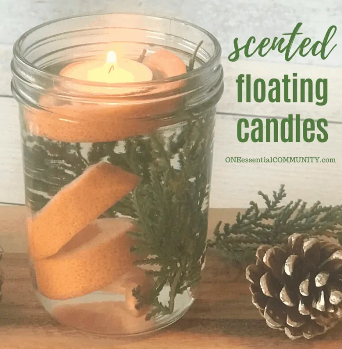 scented floating candles one essential community essential oil candle orange peels fir sprigs pine cones