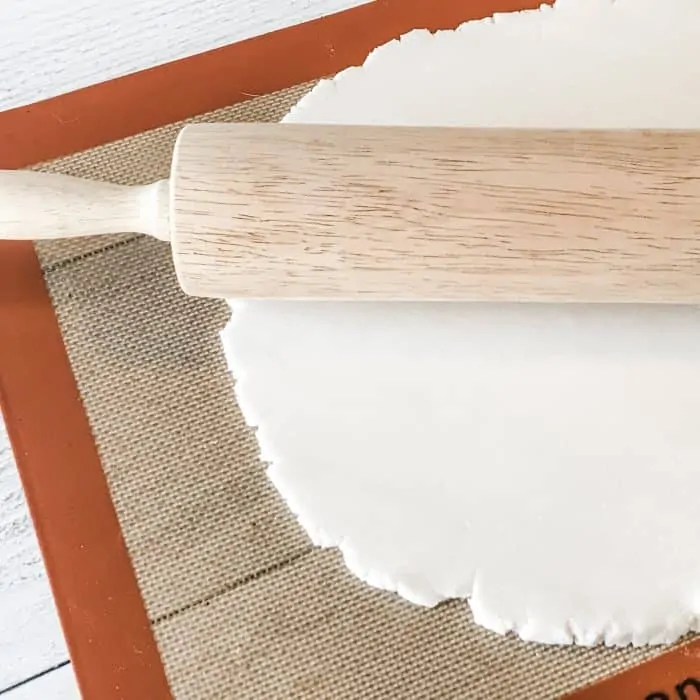 rolled out salt dough on silpat with rolling pin