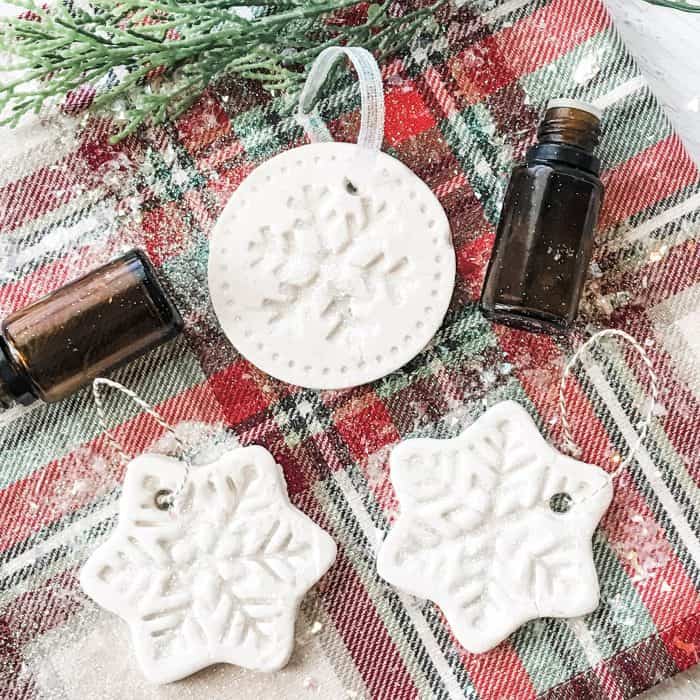 homemade salt dough christmas tree ornaments, adding ribbon or twine to them for hanging on Christmas tree