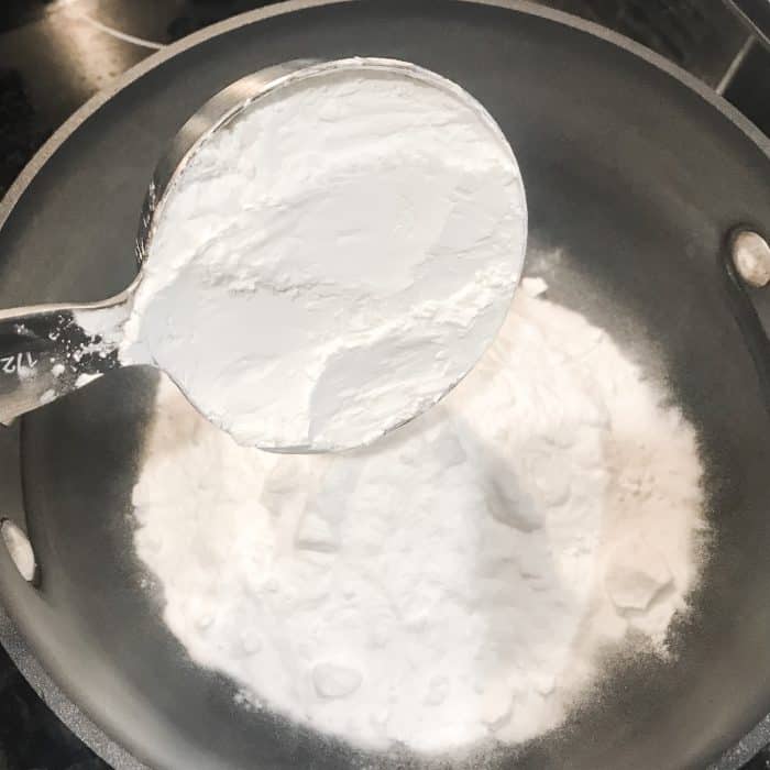 adding cornstarch to baking soda in saucepan