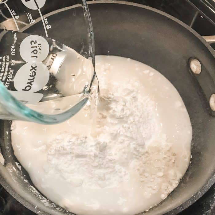adding water to baking soda and cornstarch in saucepan