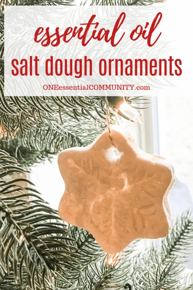 Essential Oil salt dough ornaments title image with snowflake-shaped ornament hanging from Christmas tree