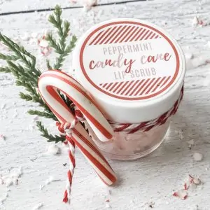 candy cane lip scrub with evergreen sprig tied on with red & white twine
