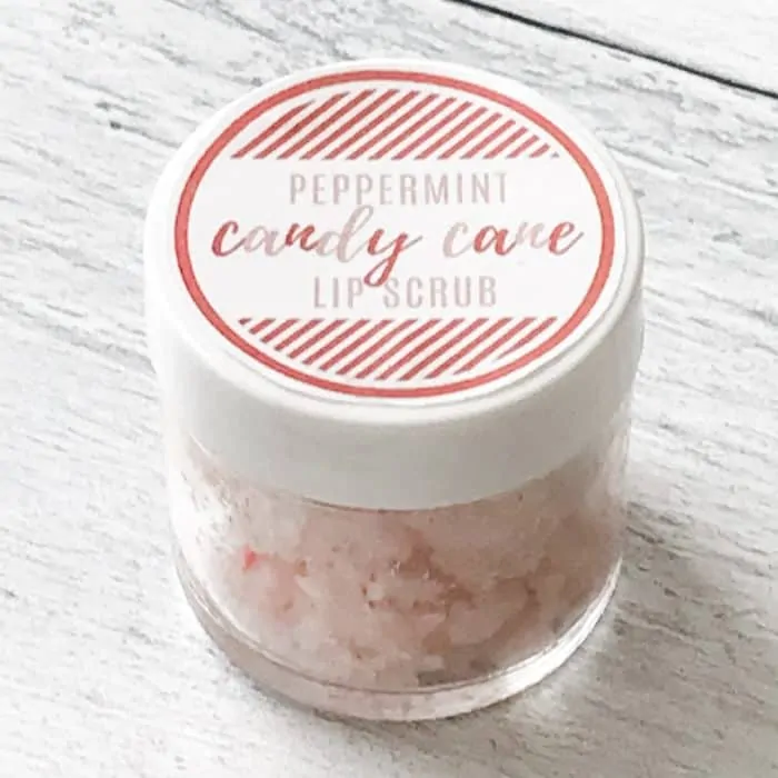 peppermint candy cane lip scrub with essential oils in glass jar closed with lid and custom label