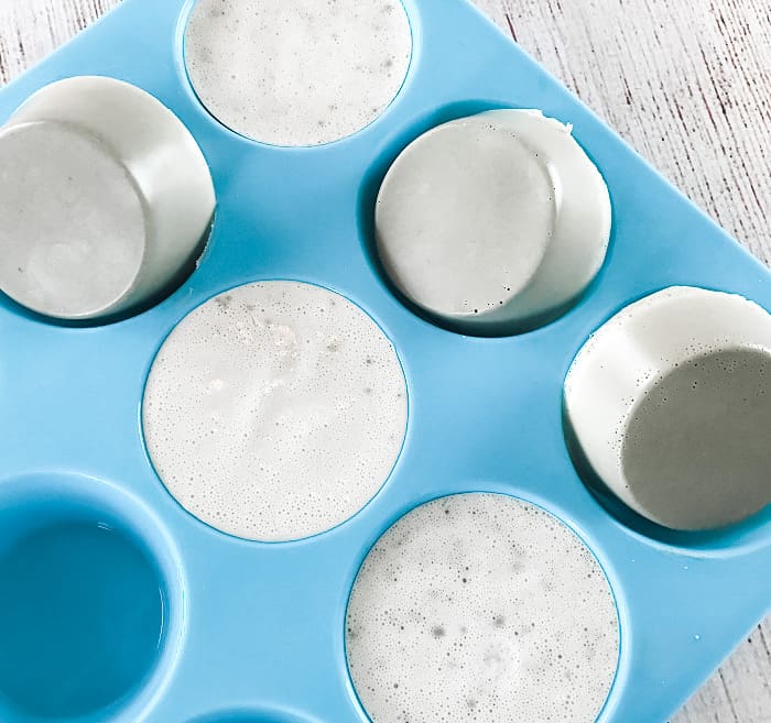 DIY clay facial soap in silicone molds set into solid discs ready to pop out clay facial soap bars with essential oil