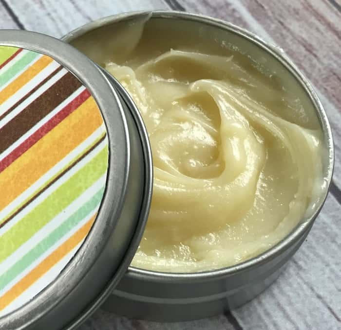 energy boosting rub with essential oils and olive oil and coconut oil and beeswax in tin boost energy fight fatigue