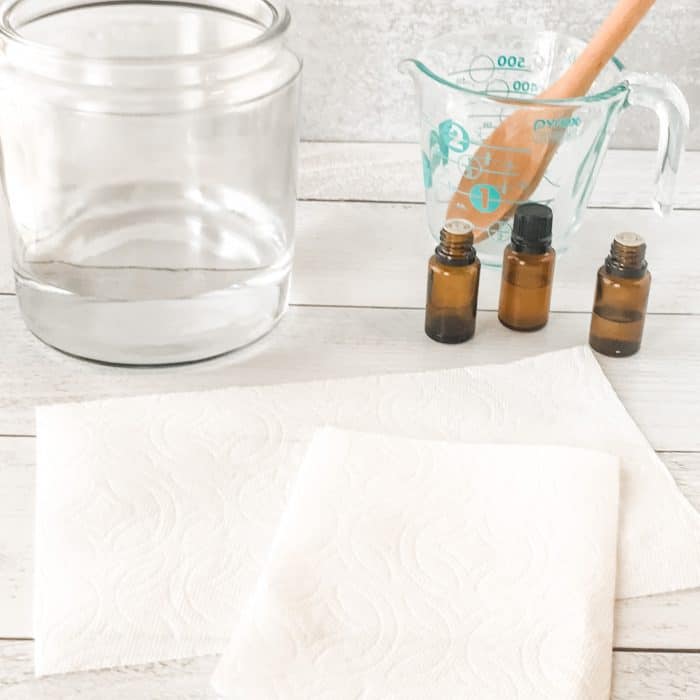 prepping paper towels to add to homemade disinfecting wipes cleaning solution