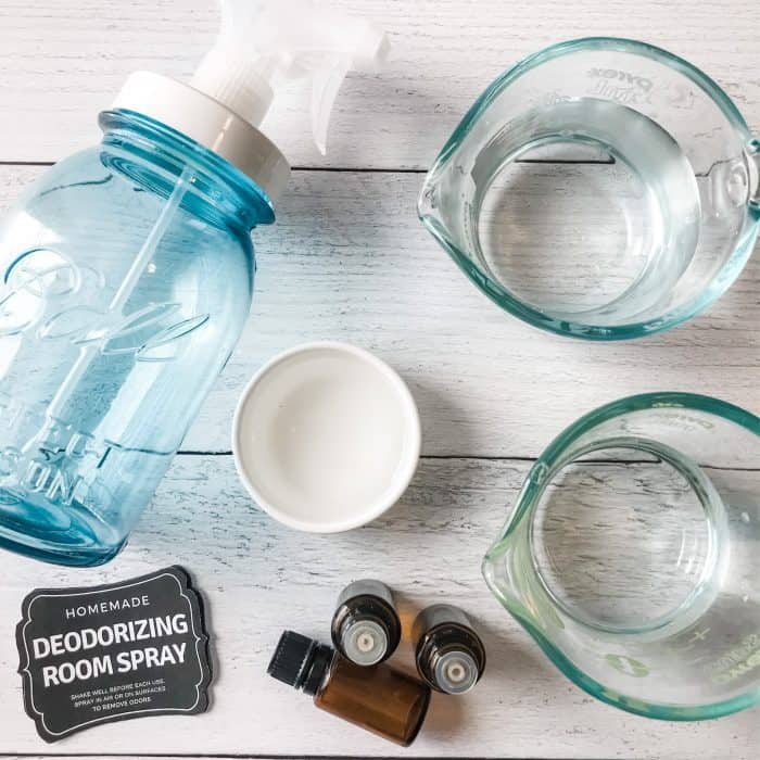 supplies used to make deodorizing room spray - vinegar, alcohol, essential oil, and distilled water
