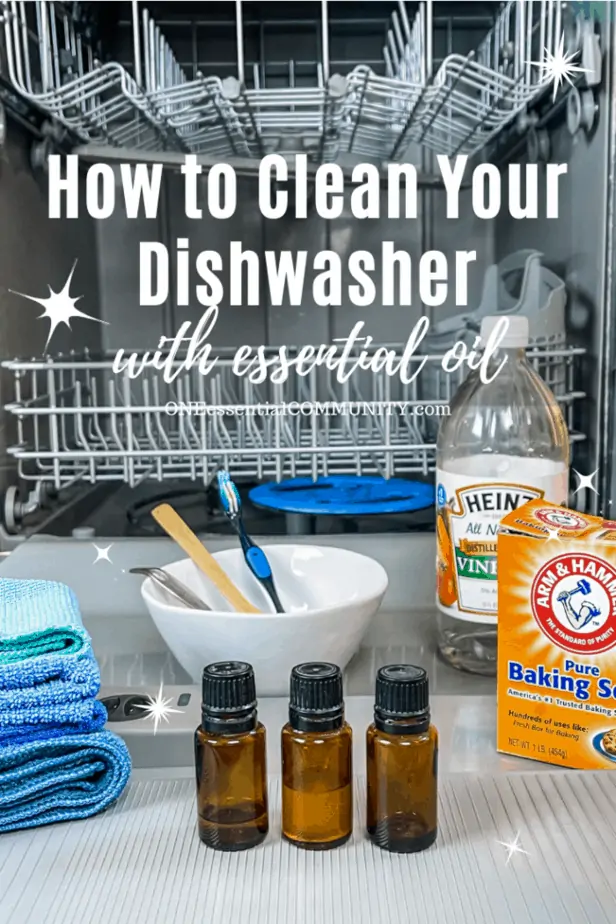 open dishwasher with cleaning supplies (essential oil, baking soda, vinegar)