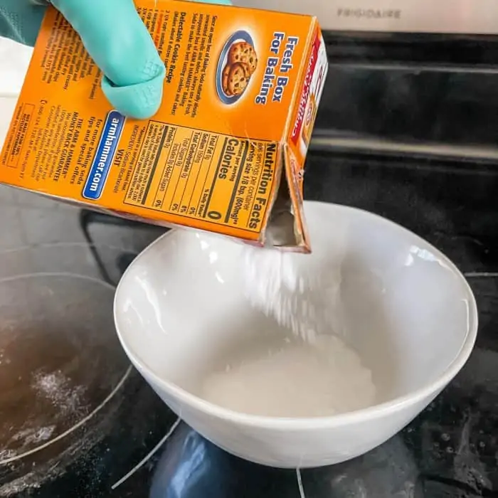 adding baking soda to bowl