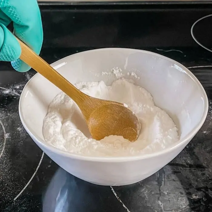 stirring baking soda and essential oil together