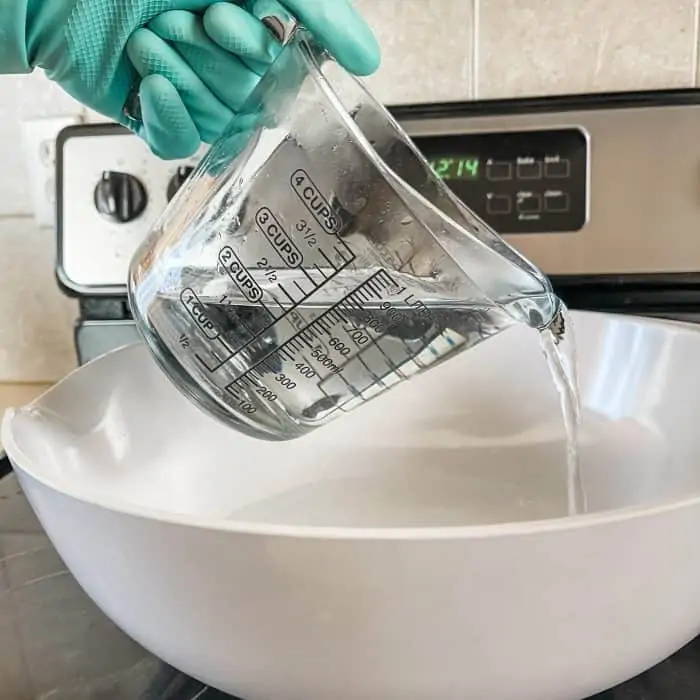 pouring very hot water into extra large bowl