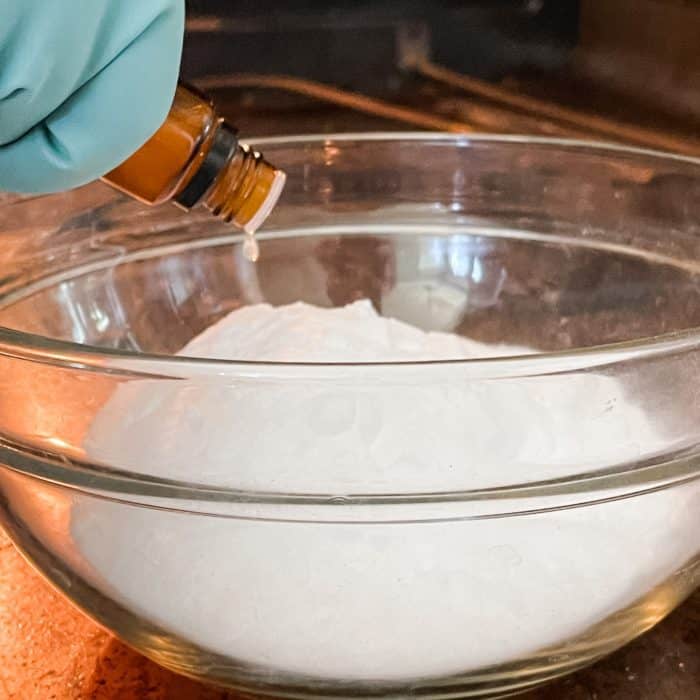 adding essential oil to baking soda for natural oven cleaner