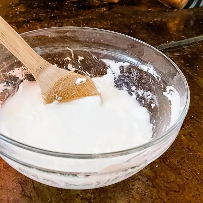 stirring baking soda mixture until it forms a spreadable paste