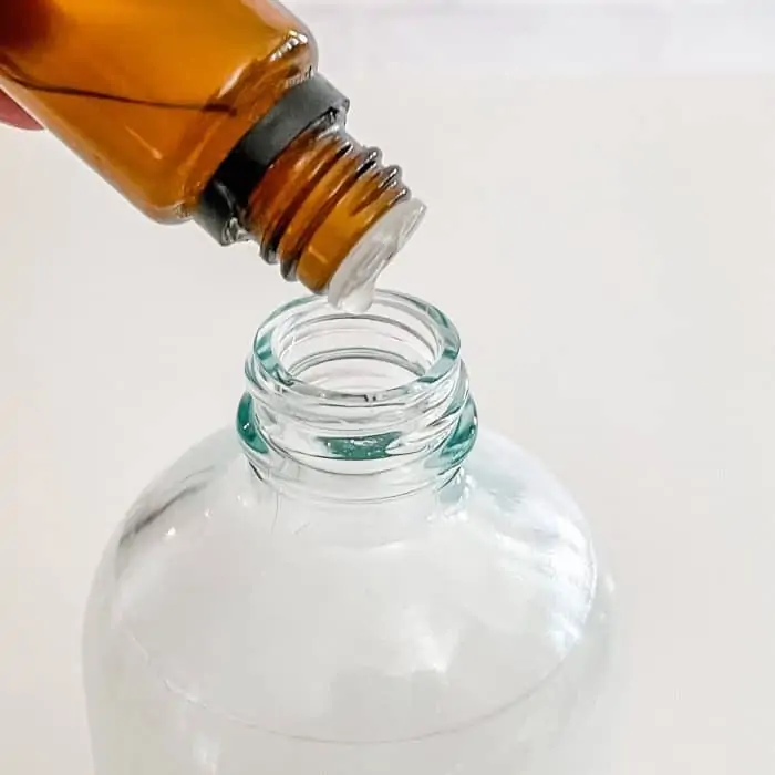 adding essential oil to spray bottle