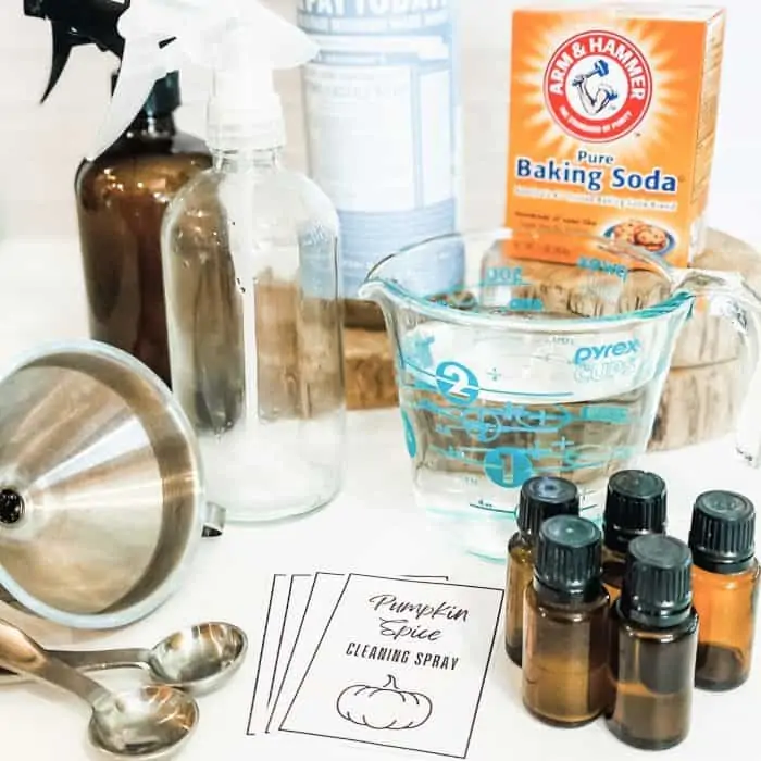 ingredients to make pumpkin spice latte cleaner -- baking soda, distilled water, Castile soap, and essential oil -- also shows free printable labels for pumpkin spice cleaning spray